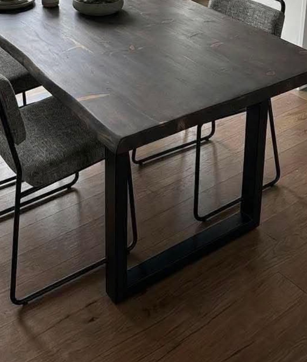 The underside and legs of a solid-wood table