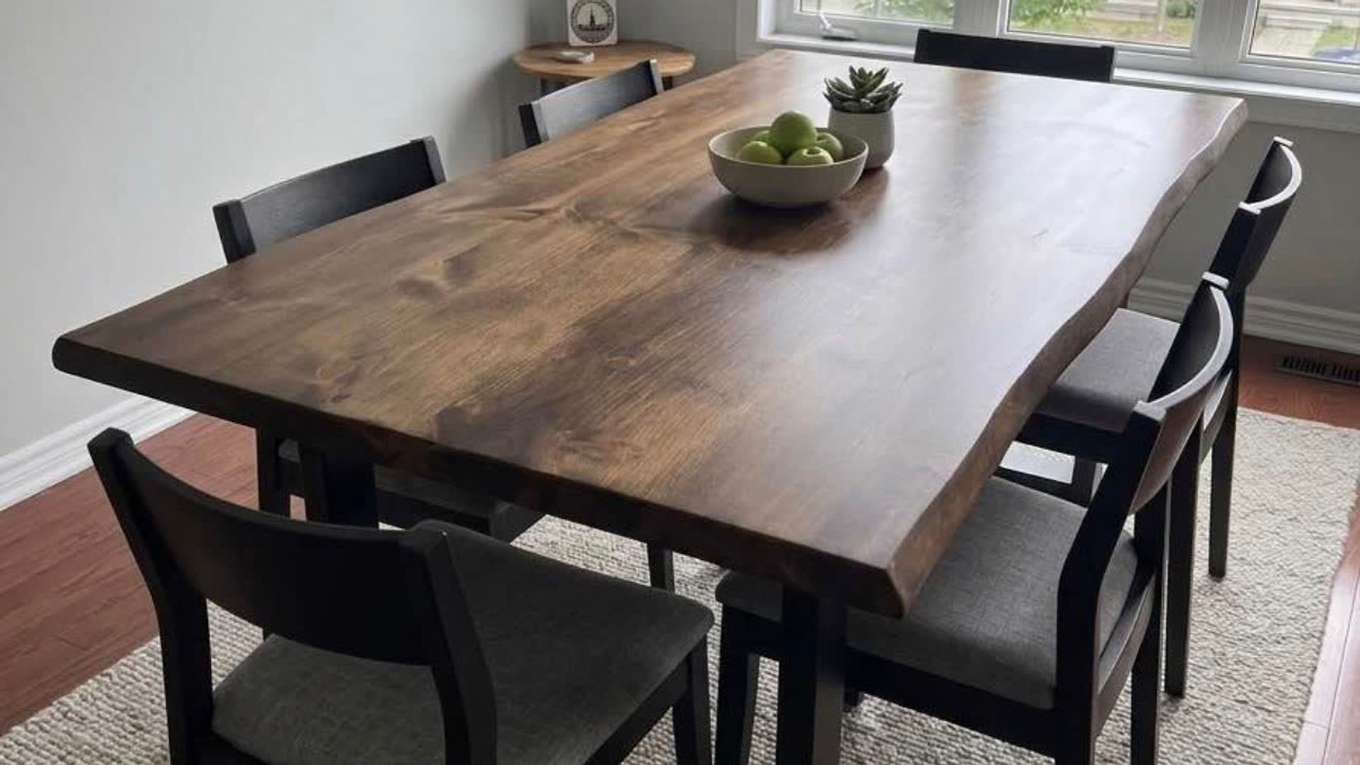 A handmade solid-wood dining table in a family kitchen