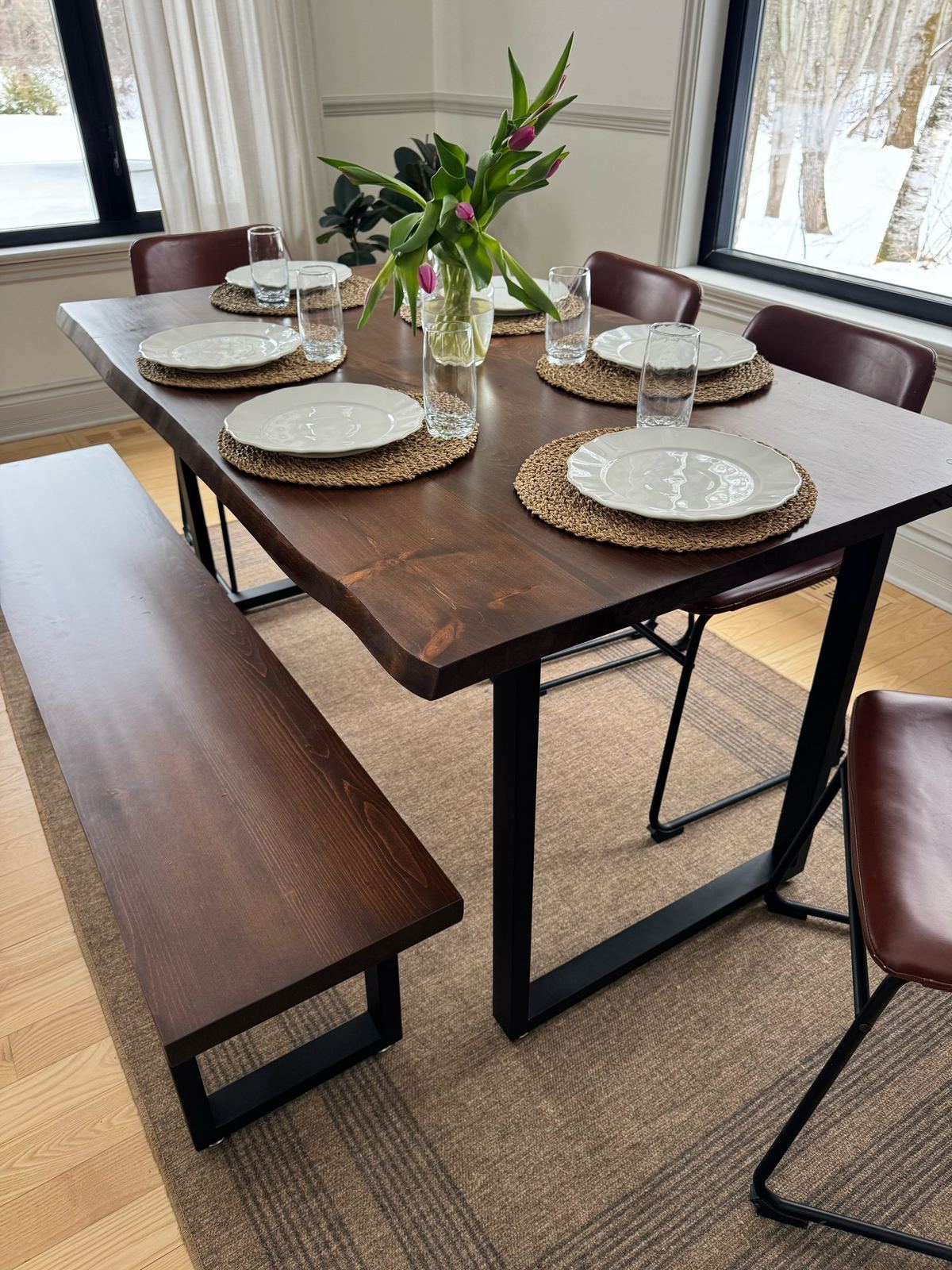 Overhead view of a solid-wood table with tulips